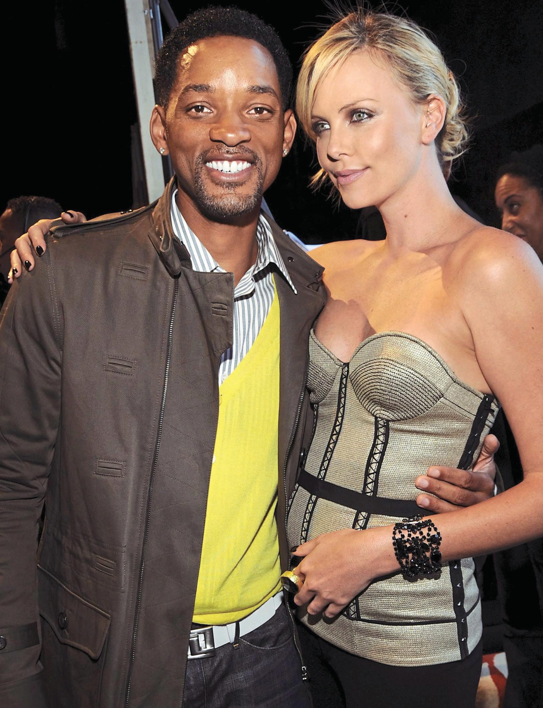 CHARLIZE PROPS UP WILL AFTER SLAPGATE!