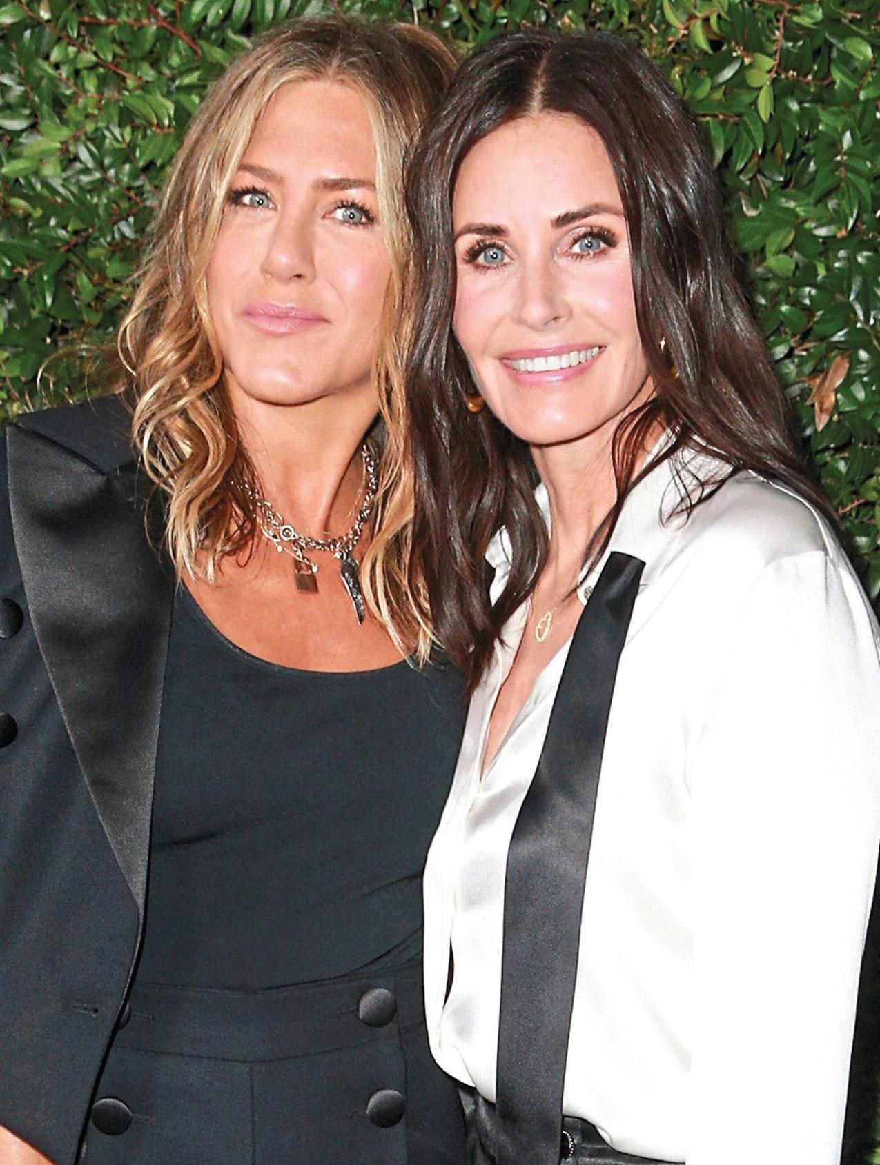 COX VIES WITH FRIEND ANISTON