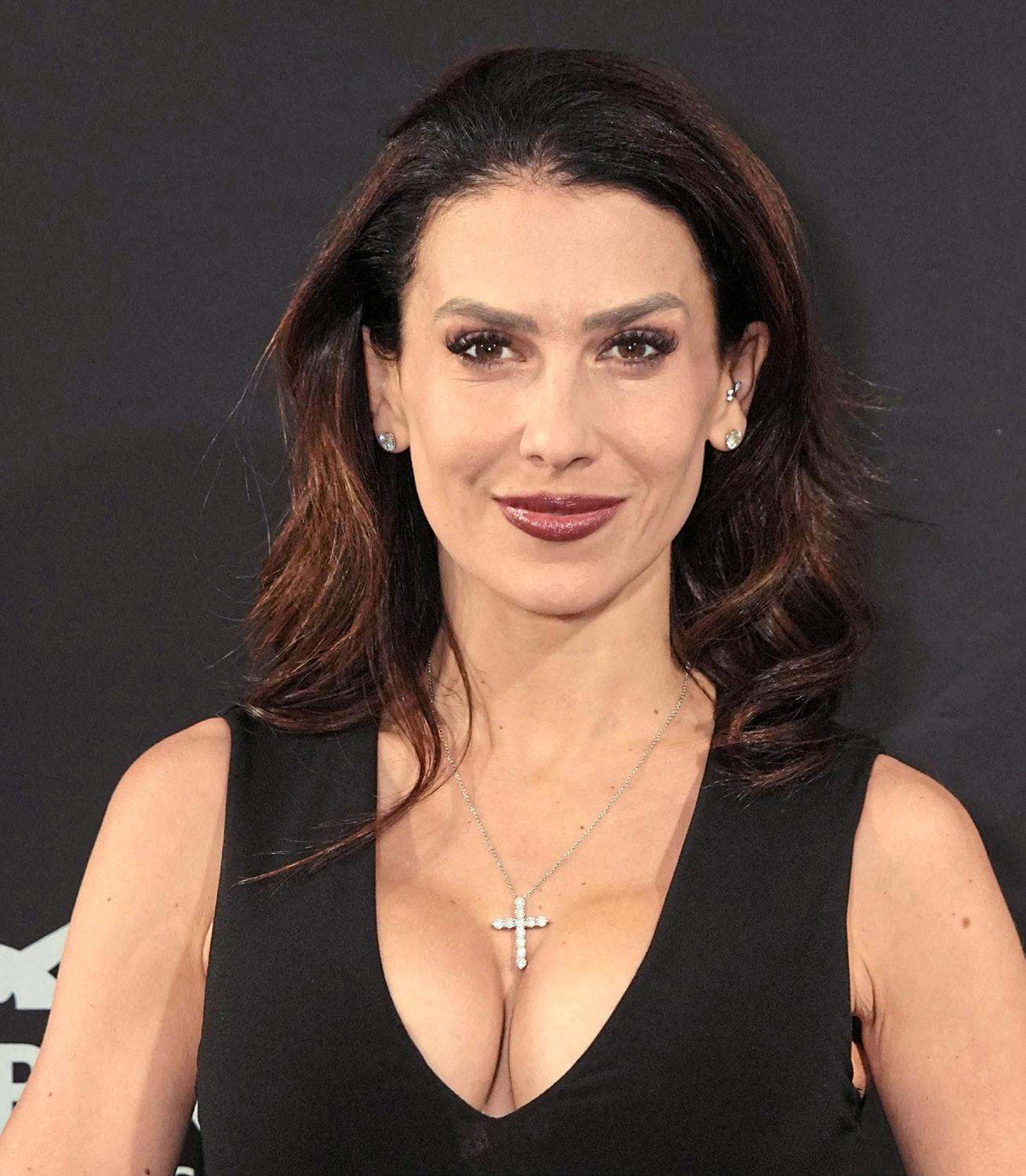 HILARIA FLIRTFEST TIES ALEC IN KNOTS