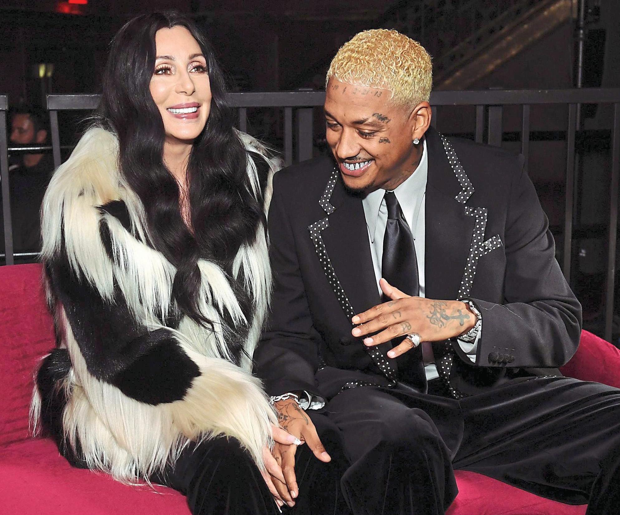 CHER PUTS ΒΟΥΤΟΥ ON VERY LONG LEASH