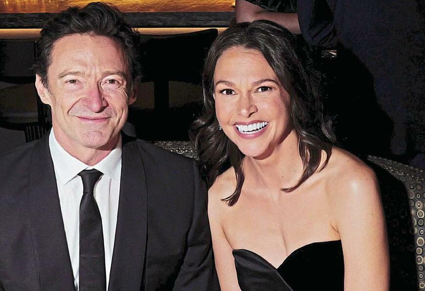 HUGH DOG! JACKMAN LAPS UP KATE'S ATTENTION