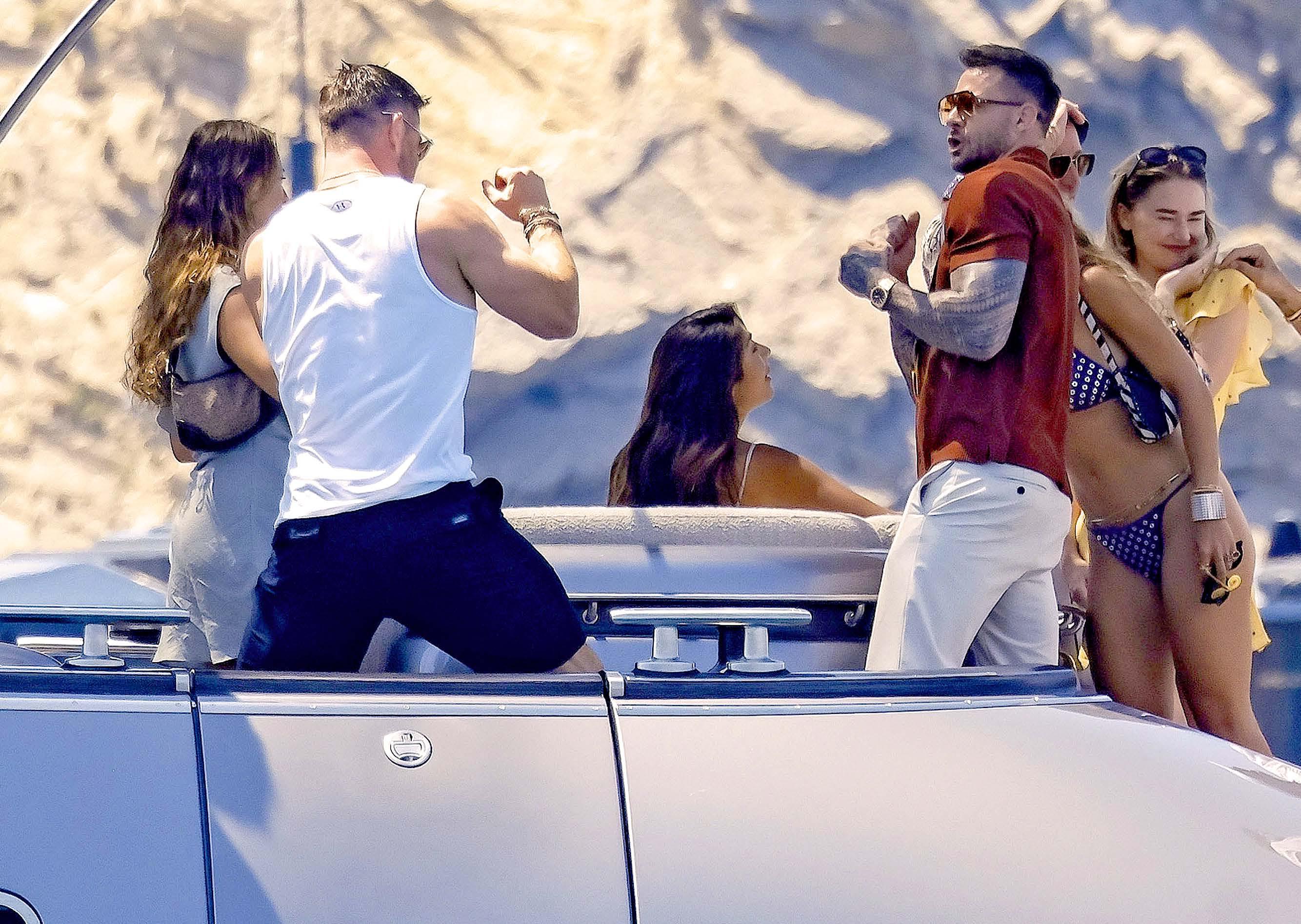 CHRIS PARTIES IN SPAIN... without Elsa!