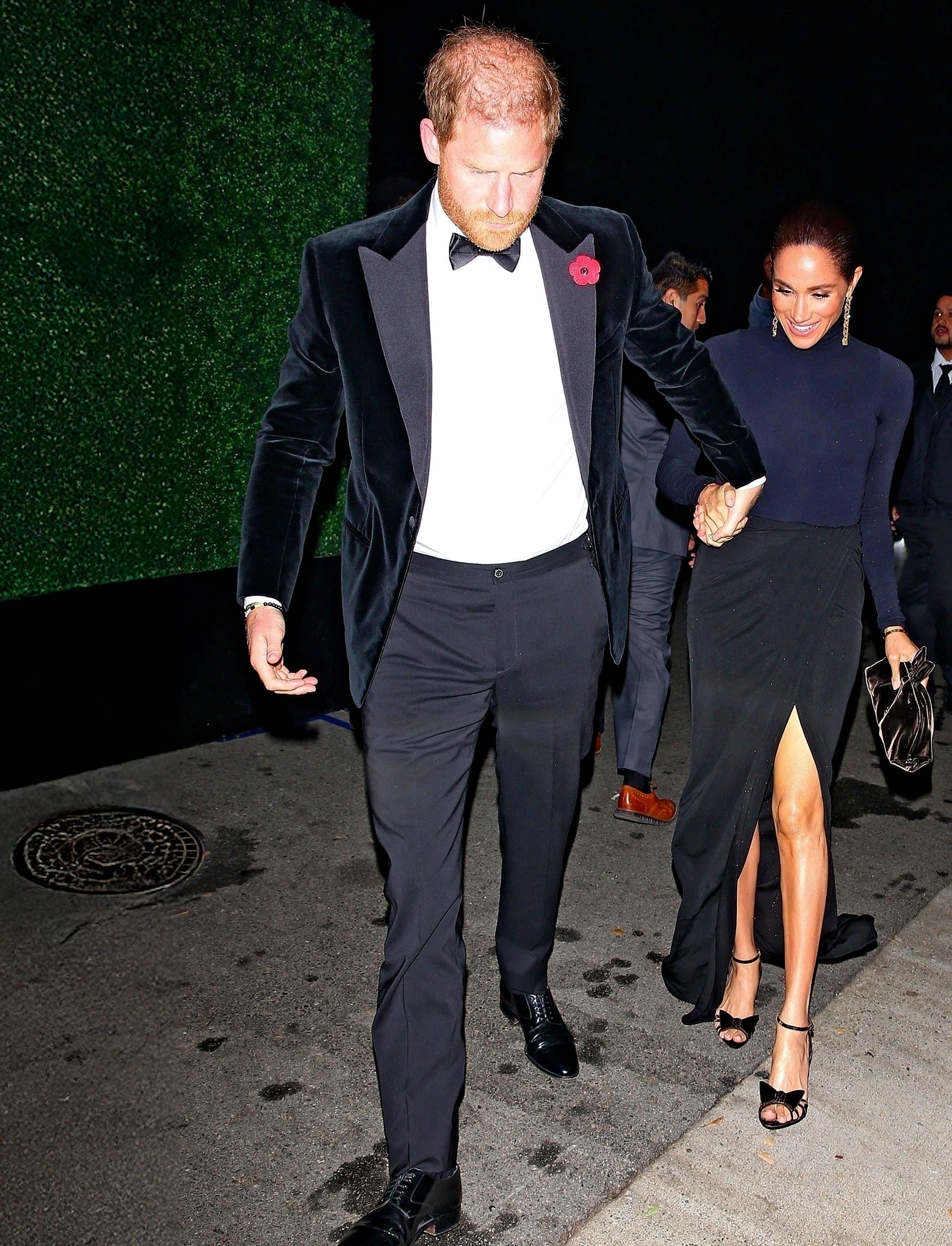 PARTY PHOTO HUMILIATED HARRY HEADS HOME