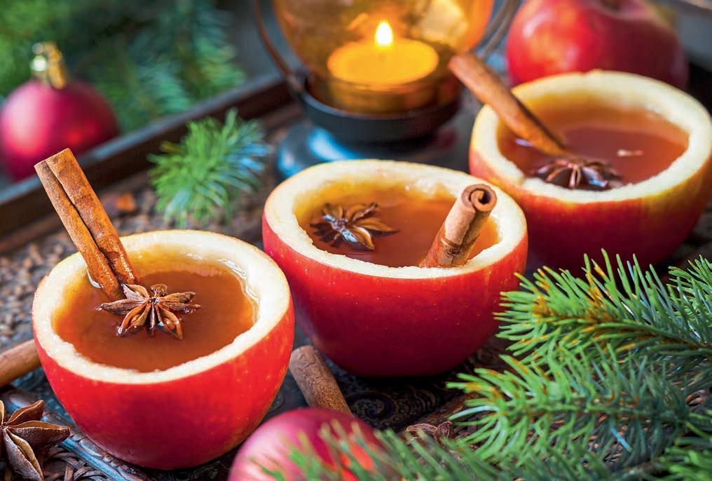Warm spiced apple cider in real apple cups