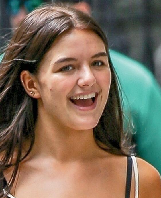 SURI FOLLOWS IN MUM'S FOOTSTEPS