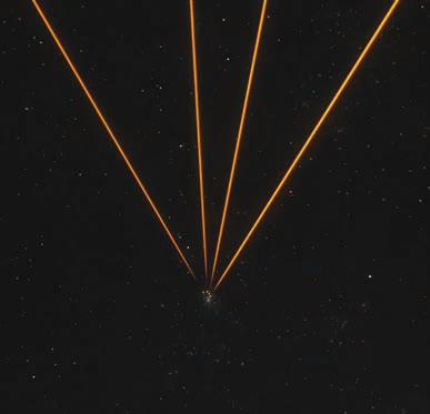LASERS TARGET THETARANTULA NEBULA WITH 'ARTIFICIAL STARS'