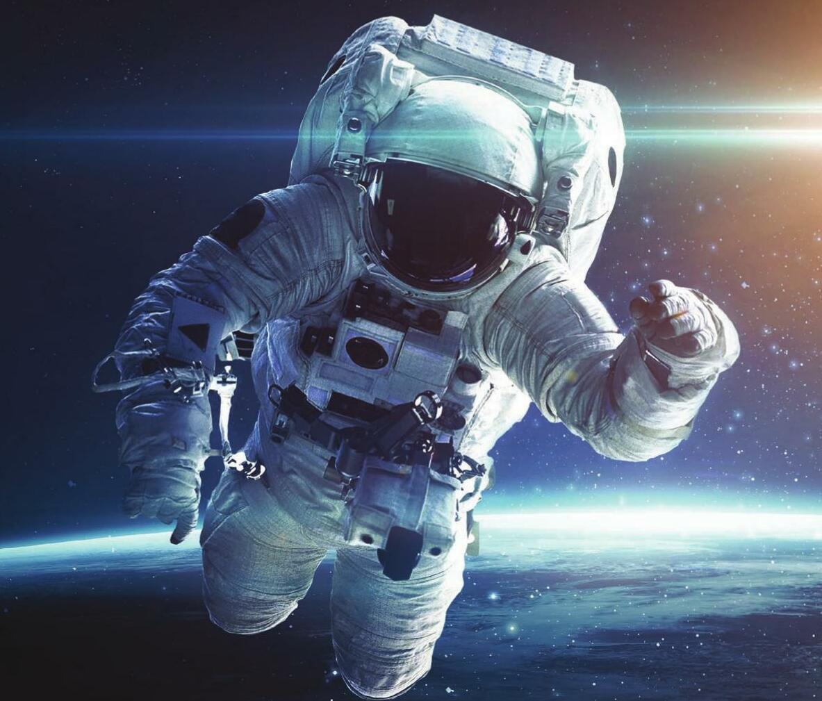 How do astronauts prepare for a spacewalk?