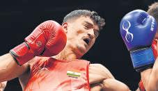 Top boxers progress, refereeing under fresh scrutiny