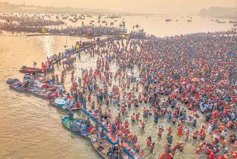 Devotees take holy dip at the Sangam