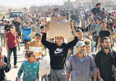 Gunfire Heard as Huge Crowds Rush to Pick Aid From Gaza Centre