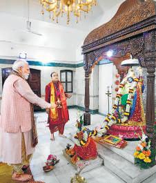 PM takes part in Durga Puja prayers at CR Park
