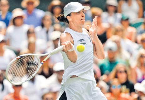 Swiatek survives scare to reach second round