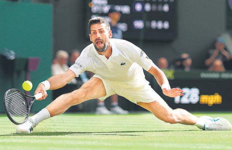Djokovic stretched, finds a way to grind past De Minaur