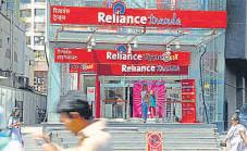Retail, Jio lift Reliance to record profit as oil cools