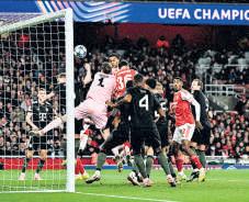 Arsenal soar against Bayern, Liverpool sink versus PSV