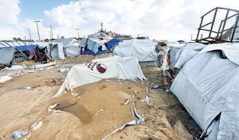 Displaced Gazans struggle with winter chill as heavy rains lash shelters, camps