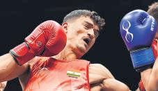 Top boxers progress, refereeing under fresh scrutiny