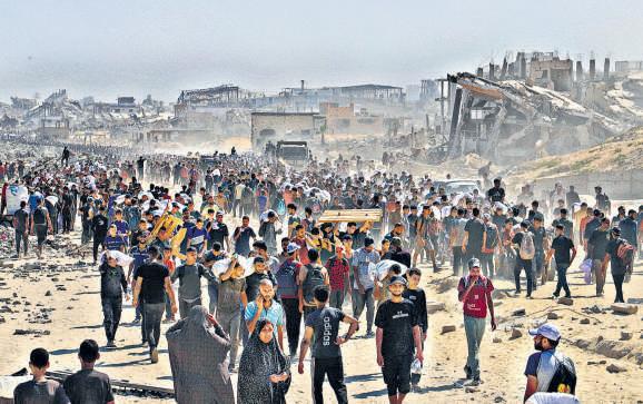 Israel says it’s opening routes to allow aid convoys into Gaza Strip