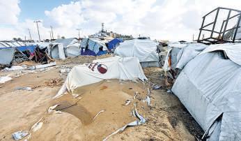Displaced Gazans struggle with winter chill as heavy rains lash shelters, camps