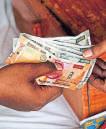 Rupee falls below 91 vs dollar as govt blames trade gap
