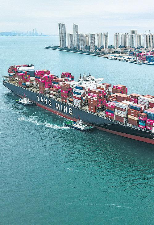 Cargo ships running on oil are cruising slowly into the sunset
