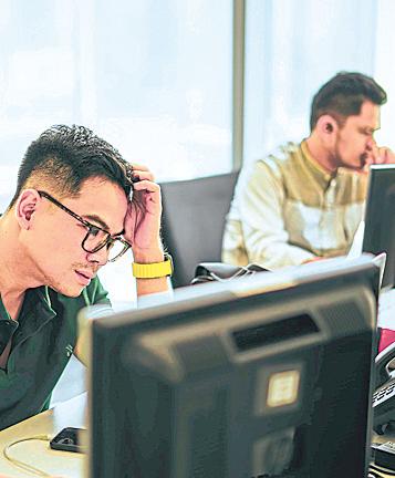 More big companies bet they can still grow without hiring