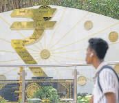 Rupee braves turbulent month