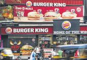 Operator of Burger King Narrows Loss