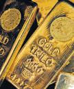 Gold, silver fall as traders take stock of record rallies