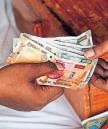 Rupee falls below 91 vs dollar as govt blames trade gap