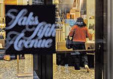 Saks Global files for bankruptcy, undone by debt and a luxury slump