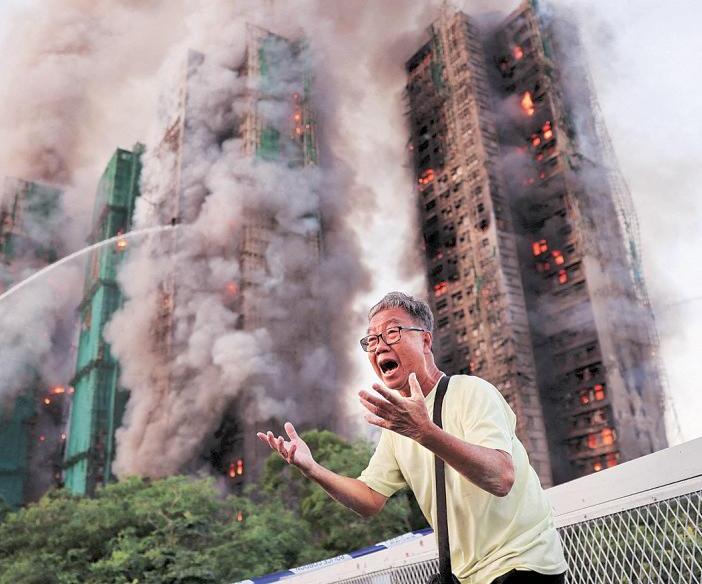 At least 13 dead as massive fire engulfs Hong Kong apartments