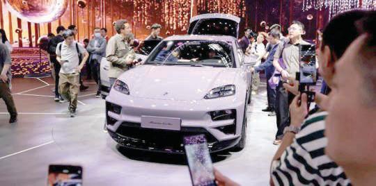 Porsche’s net profit slashed by a third