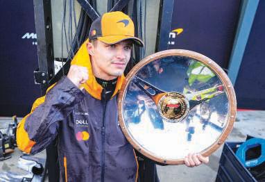 Norris holds off world champion Verstappen to win rain-hit Formula One opener Australian Grand Prix