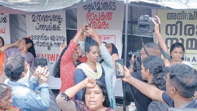 Ashas trim hair in protest against govt apathy