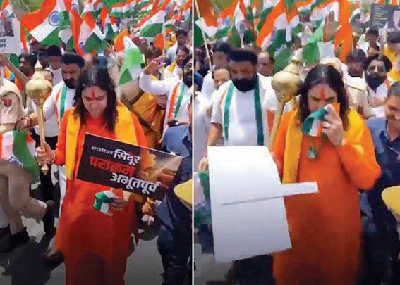 BJP MLA wipes sweat with Tricolour during rally