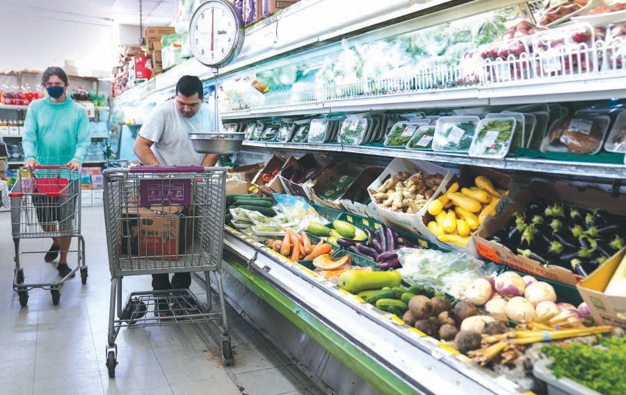 Gloomy Americans cut back on spending as inflation ticks higher