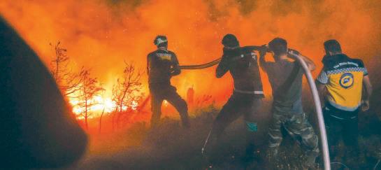 Syria wildfires force hundreds to flee