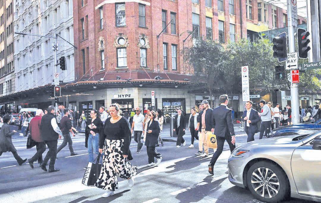 Australia's central bank cuts rates by 25 bps, still cautious about outlook