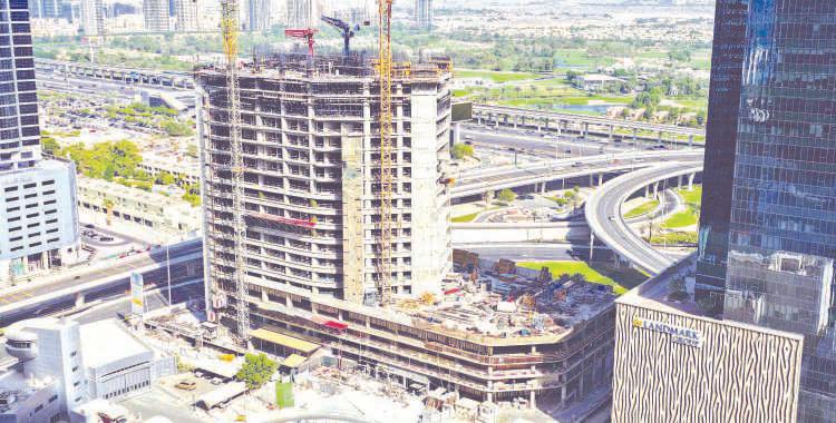 Firms mark major construction milestones