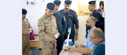 Displaced, forces vote early in Iraq elections