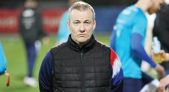 Faroe Islands part-timers, crime novelist coach are dreaming of the World Cup