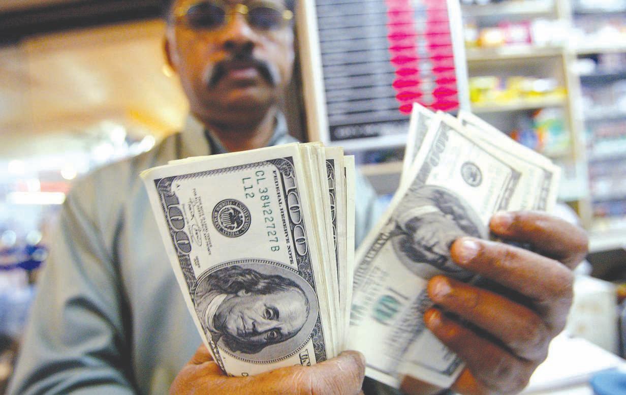 Dollar hedging frenzy fades, bringing relief to greenback