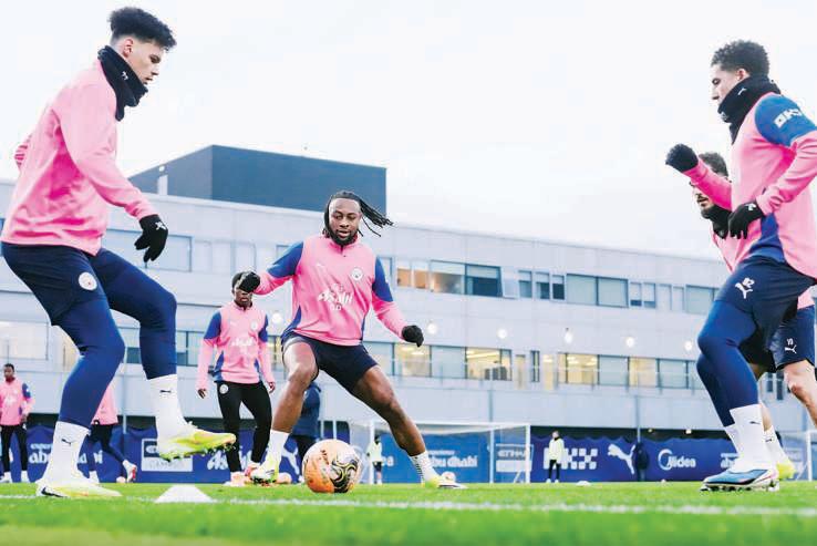 Guardiola downplays trophy talk, focuses on City growth