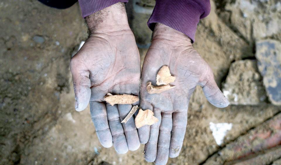 A father searches for his family's bones in rubble of Gaza's home