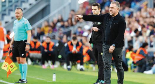 Coach Flick braced for Racing test after Barcelona's Super Cup glory