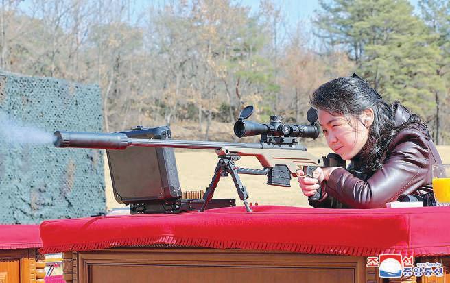 Kim's daughter seen firing rifle in rare image