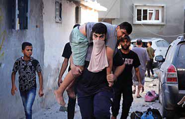 Israeli Strikes Kill Civilians At Shelters In Gaza Combat Zone As ...