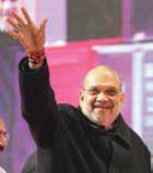 Shah promises slum dwellers houses, says will uproot 'AAPda'