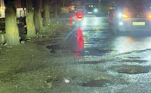 First floods, now bumpy roads: City struggles on...